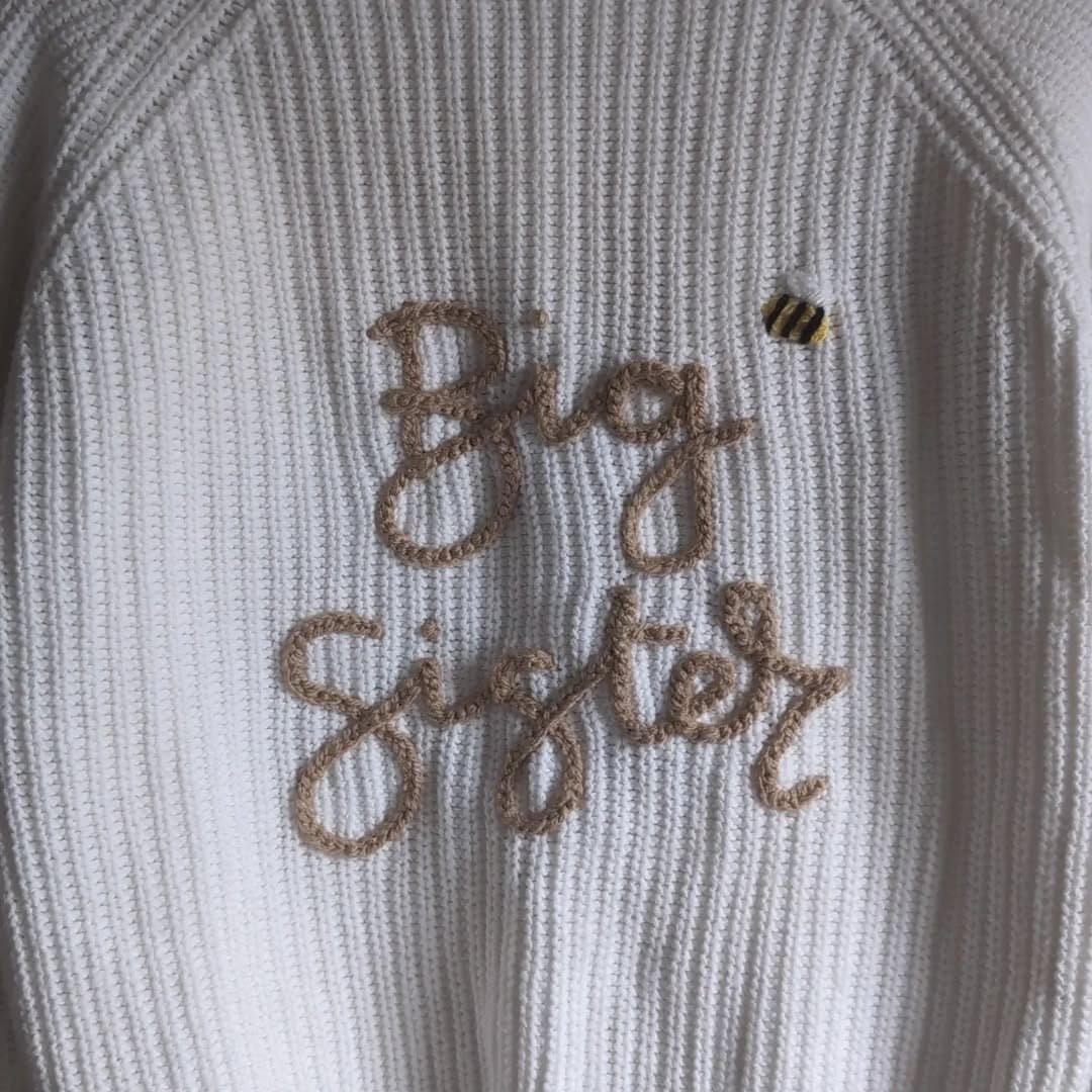 Instagram post: 🐝 Big Sister ✨

Knit Details 
🪡 White Knit 
🧶 C...